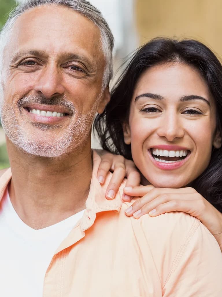 Cheerful couple with bright smiles